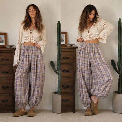 Woman wearing the Boho plaid balloon pants in Lavender with a crochet cardigan