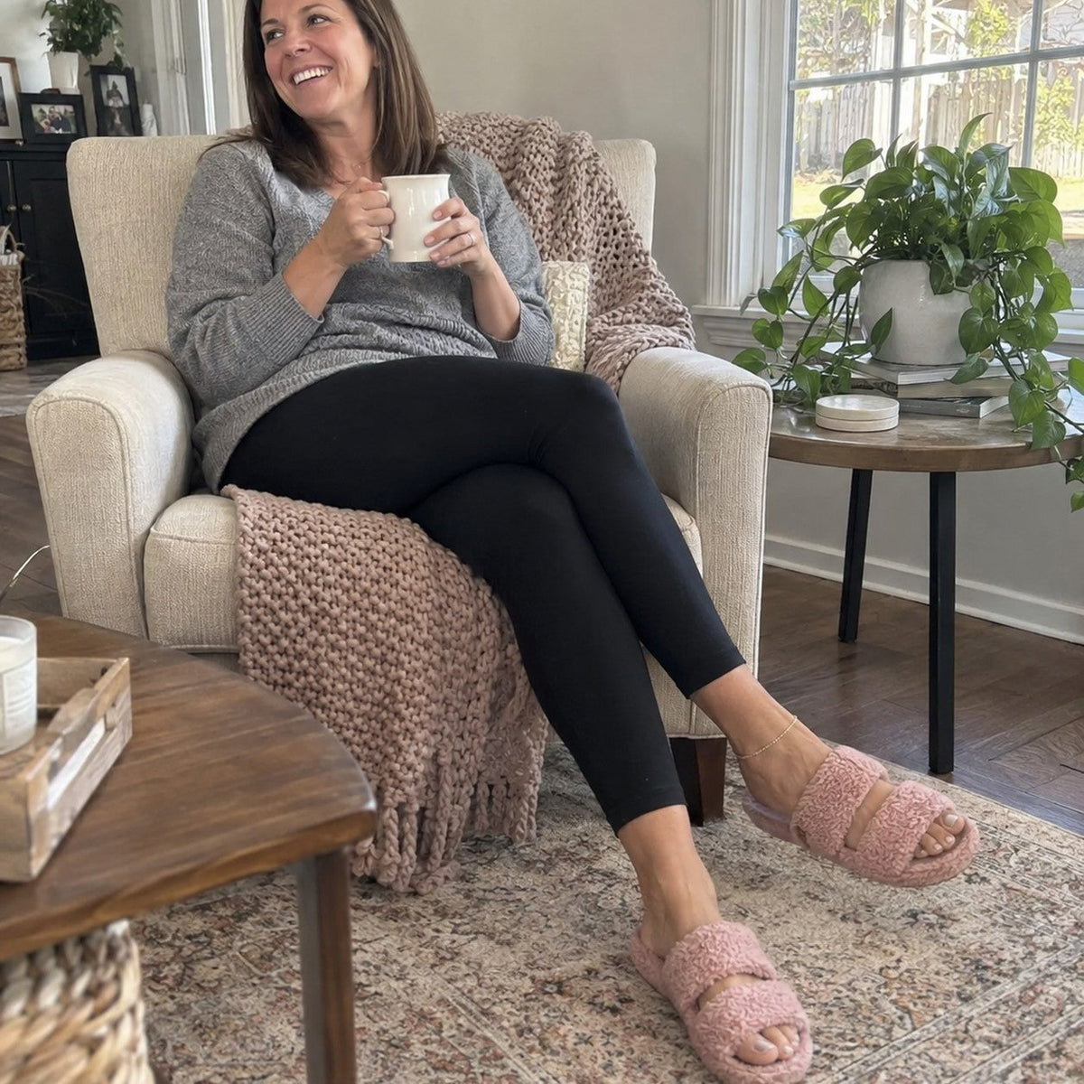 Woman wearing Fuzzy slides in Dusty Rose at home