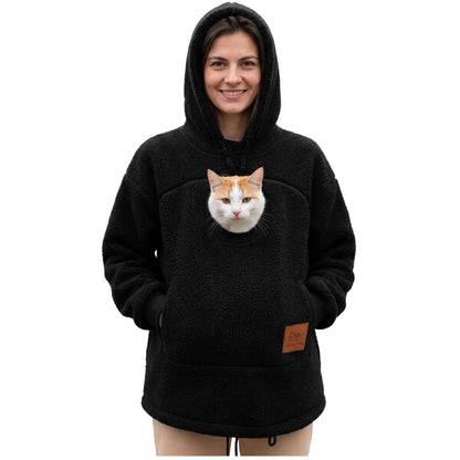 Meowdie cat pocket hoodie in Black, cat peeking out of the zip pouch