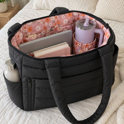 Puffy tote in Black with a laptop, books and a tumbler in the inner cup holder